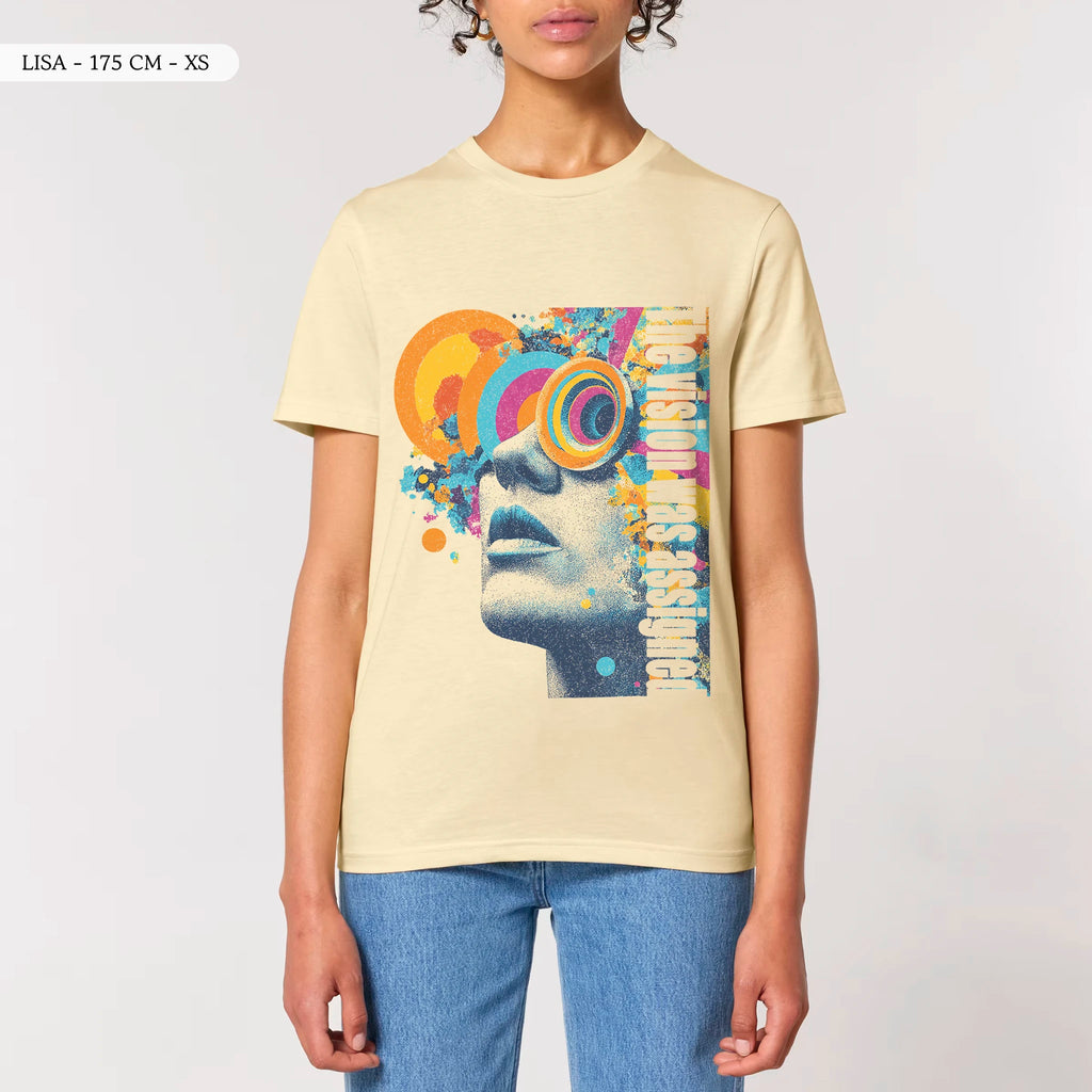 Front view of a female model wearing the TOLS Assigned Vision unisex organic cotton T-shirt in butter color.