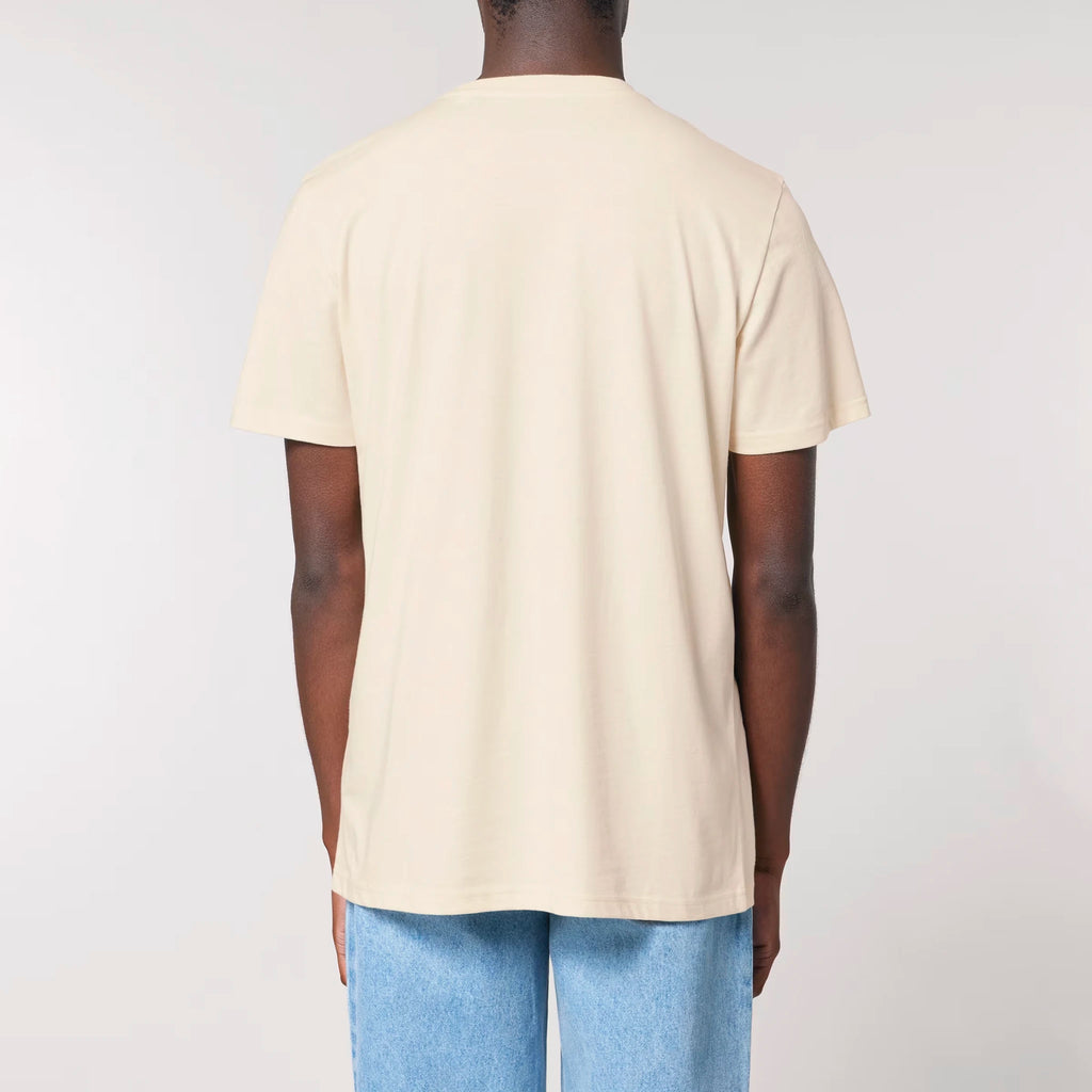 Back view of a male model wearing the TOLS Assigned Vision unisex organic cotton T-shirt in natural raw color.