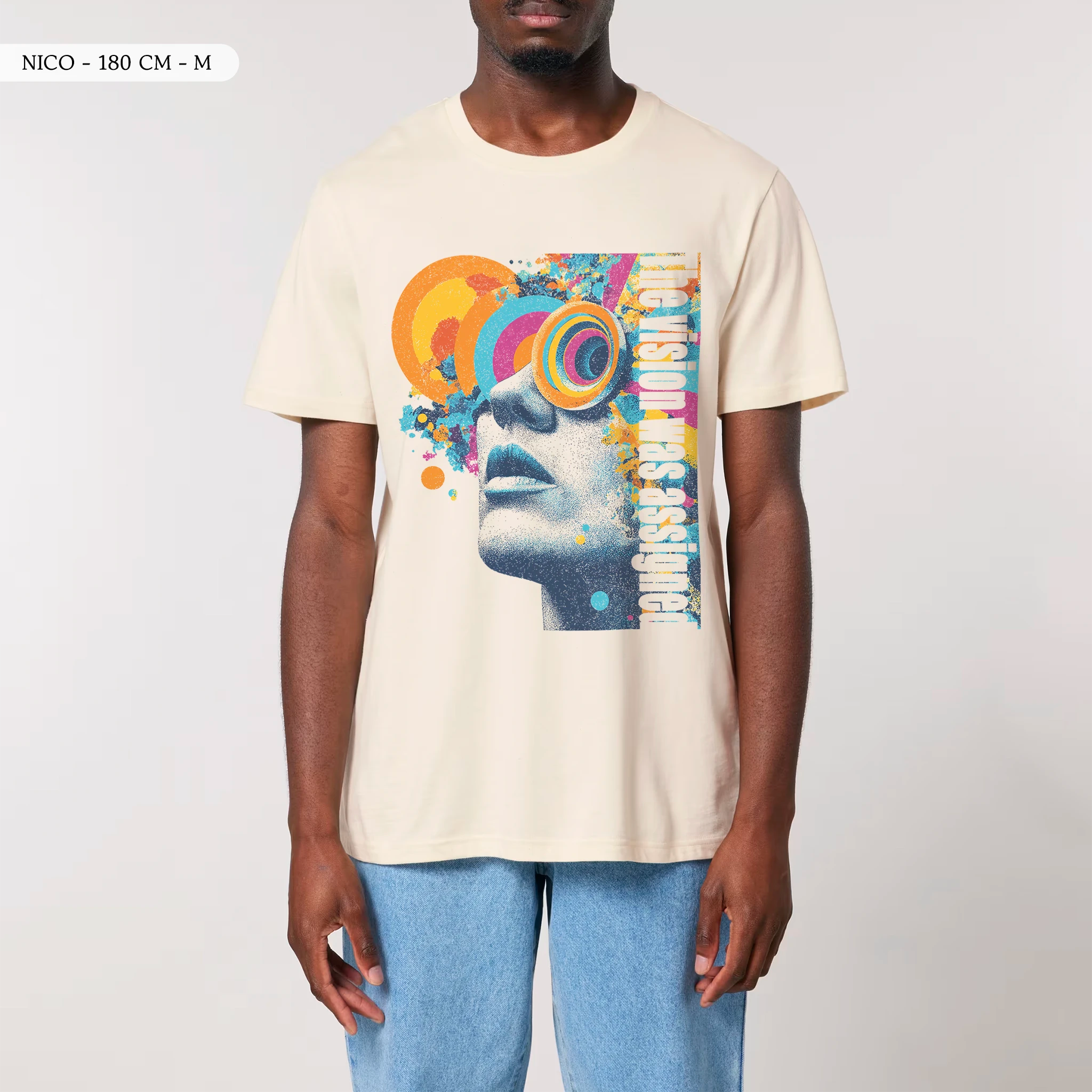 Front view of a male model wearing the TOLS Assigned Vision unisex organic cotton T-shirt in natural raw color.